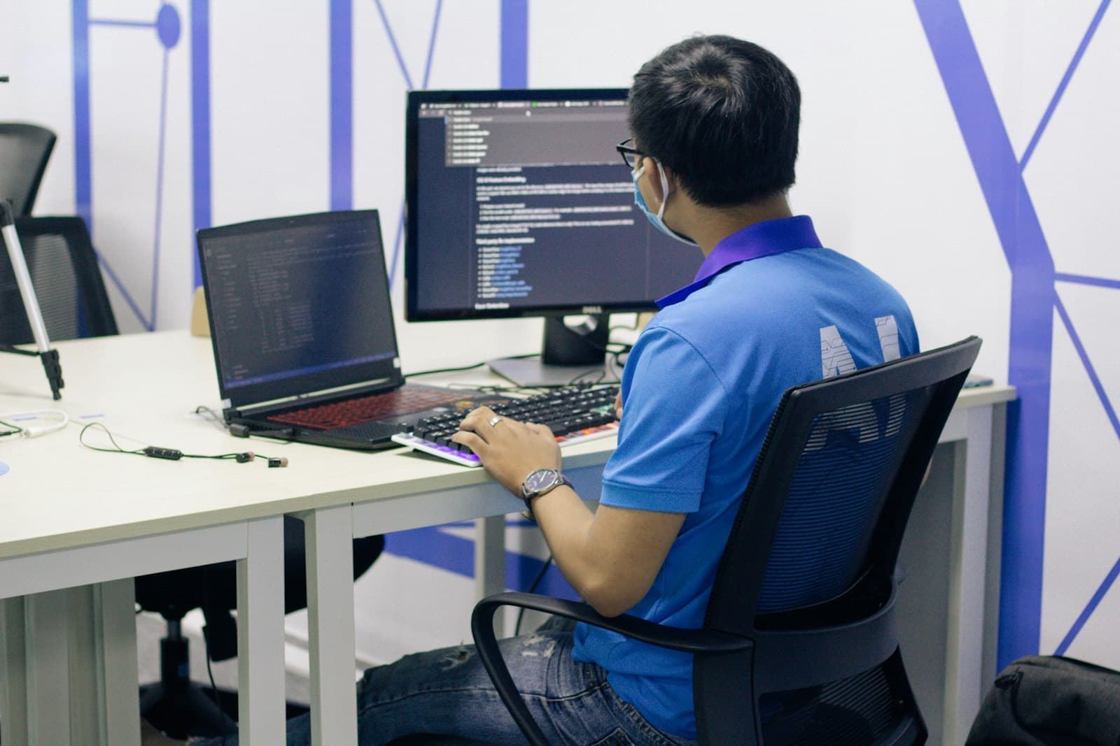 Engineer working at a dual-screen desk