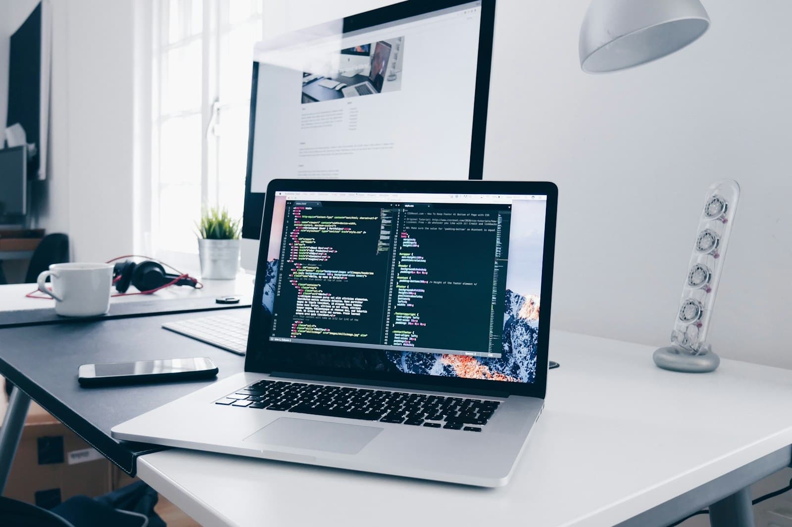 Development workspace with a MacBook and an external display